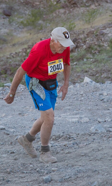A competitor within the run route participates in the first annual Telegraph Pass Challenge in Yuma, Ariz., Nov. 3, 2018. The challenge, coordinated by Marine Corps Community Services (MCCS), offered participants the opportunity to compete for first, second, or third place in either a 5 mile run, 5 mile bike route, or both. The course included a "Blue Mile" which is typically the most difficult portion of the racing event being a silent mile. The "Blue Mile" honors and remembers all fallen heroes of the Military, Police, and Fire Department. (U.S. Marine Corps photo by Lance Cpl. Joel Soriano)