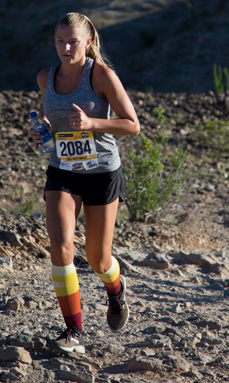 A competitor within the run route participates in the first annual Telegraph Pass Challenge in Yuma, Ariz., Nov. 3, 2018. The challenge, coordinated by Marine Corps Community Services (MCCS), offered participants the opportunity to compete for first, second, or third place in either a 5 mile run, 5 mile bike route, or both. The course included a "Blue Mile" which is typically the most difficult portion of the racing event being a silent mile. The "Blue Mile" honors and remembers all fallen heroes of the Military, Police, and Fire Department. (U.S. Marine Corps photo by Lance Cpl. Joel Soriano)