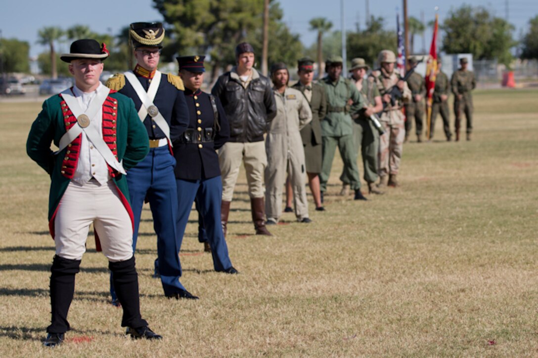 U.S. Marines with Headquarters and Headquarters Squadron, Marine Corps Air Station Yuma, participate in the 243rd Marine Corps birthday uniform pageant at the Parade Deck on Marine Corps Air Station Yuma, Ariz., Nov. 8, 2018. The annual ceremony was held in honor of the 243rd Marine Corps birthday, showcasing historical uniforms to honor Marines of the past, present and future while signifying the passing of traditions from one generation to the next. (U.S. Marine Corps photo by Lance Cpl. Joel Soriano)