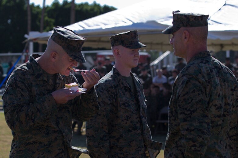U.S. Marine Corps SgtMaj. David M. Leikwold, sergeant major, Marine Corps Air Station Yuma, eats a piece of birthday cake during the 243rd Marine Corps birthday uniform pageant at the Parade Deck on Marine Corps Air Station Yuma, Ariz., Nov. 8, 2018. The annual ceremony was held in honor of the 243rd Marine Corps birthday, showcasing historical uniforms to honor Marines of the past, present and future while signifying the passing of traditions from one generation to the next. (U.S. Marine Corps photo by Lance Cpl. Joel Soriano)