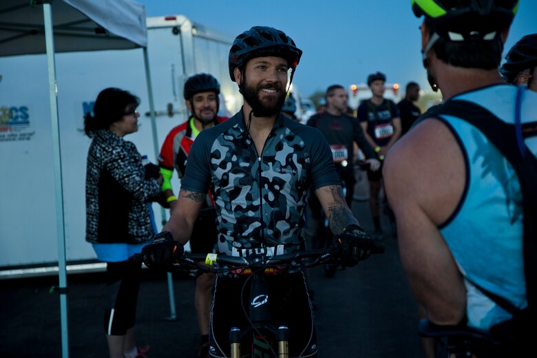 A competitor within the bike route participates in the first annual Telegraph Pass Challenge in Yuma, Ariz., Nov. 3, 2018. The challenge, coordinated by Marine Corps Community Services (MCCS), offered participants the opportunity to compete for first, second, or third place in either a 5 mile run, 5 mile bike route, or both. The course included a "Blue Mile" which is typically the most difficult portion of the racing event being a silent mile. The "Blue Mile" honors and remembers all fallen heroes of the Military, Police, and Fire Department. (U.S. Marine Corps photo by Lance Cpl. Joel Soriano)