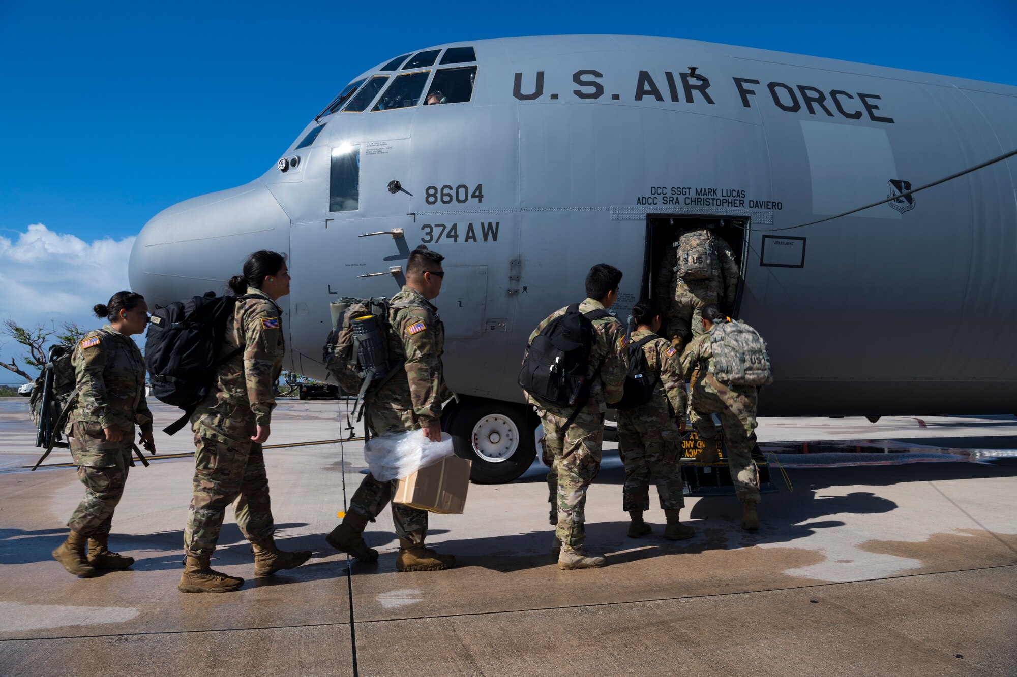 Guam Army National Guardsmen assigned to the 1224th Engineer Support Company walk onto a U.S. Air Force C-130J Super Hercules during redeployment operations Nov. 24, 2018, in Saipan, Commonwealth of the Northern Mariana Islands, after supporting the Super Typhoon Yutu relief effort.