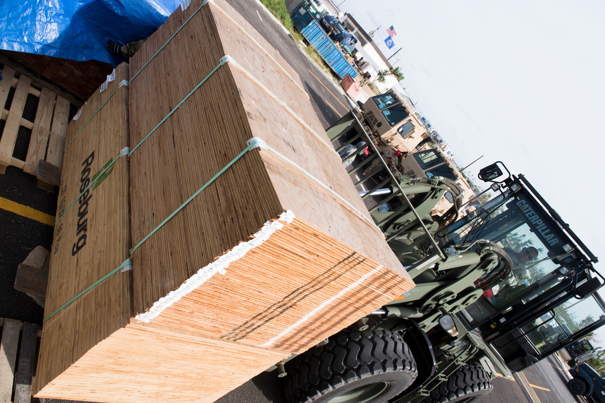 Tech. Sgt. Joe San Nicholas, 254th Rapid Engineer Deployable Heavy Operational Repair Squadron Engineers, moves plywood in preparation for Tropical Storm Man-Yi, Nov. 21, 2018, in the village of Koblerville, Saipan, Commonwealth of the Northern Mariana Islands.