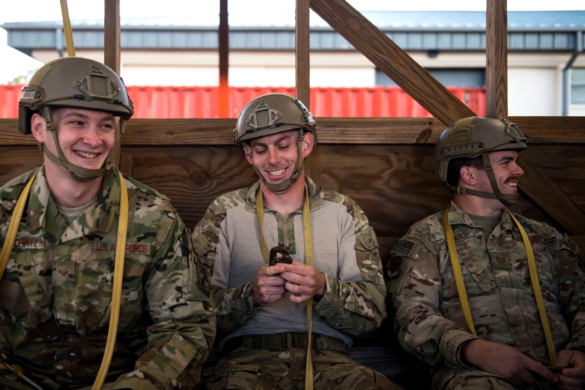Airmen from the 93d Air Ground Operations Wing share a laugh during static-line jump training, Nov. 21, 2018, at Moody Air Force Base, Ga. The overall objective of the training was to increase jumpers’ skills, knowledge and proficiency in regards to airborne operations. During a static-line jump, the jumper is attached to the aircraft via the ‘static-line’, which automatically deploys the jumpers’ parachute after they’ve exited the aircraft. (U.S. Air Force photo by Airman 1st Class Erick Requadt)