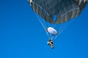 An Airman from the 93d Air Ground Operations Wing parachutes down during static-line jump training, Nov. 21, 2018, at Moody Air Force Base, Ga. The overall objective of the training was to increase jumpers’ skills, knowledge and proficiency in regards to airborne operations. During a static-line jump, the jumper is attached to the aircraft via the ‘static-line’, which automatically deploys the jumpers’ parachute after they’ve exited the aircraft. (U.S. Air Force photo by Airman 1st Class Erick Requadt)