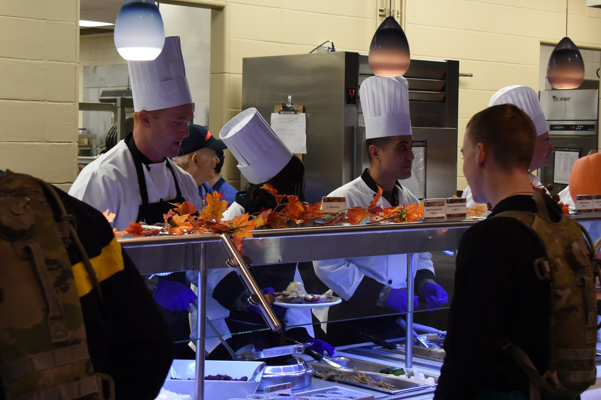 Goodfellow Leadership serves food to the Goodfellow family during the Thanksgiving Day lunch at the Western Winds Dining Facility on Goodfellow Air Force Base, Texas, Nov. 22, 2018.  The lunch was open to student and permanent party members who were unable to go home for the holiday. (U.S. Air Force photo by Airman 1st Class Zachary Chapman/Released)