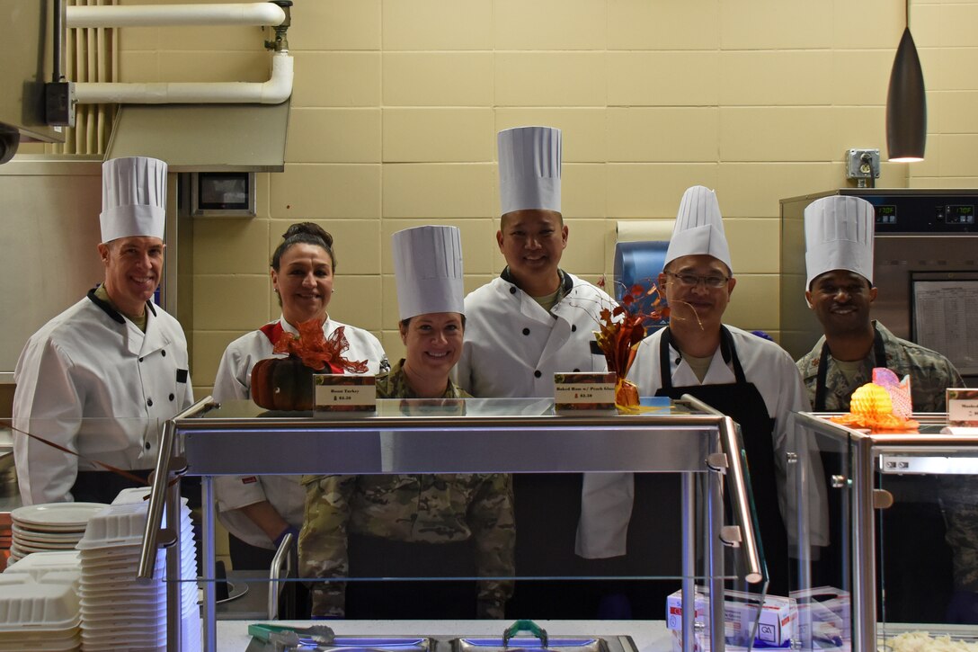 Leadership poses for a photo after the Thanksgiving Day lunch held at the Western Winds Dining Facility on Goodfellow Air Force Base, Texas, Nov. 22, 2018. The event provided a holiday experience for those unable to go home to family and friends this Thanksgiving. (U.S. Air Force photo by Airman 1st Class Zachary Chapman/Released)