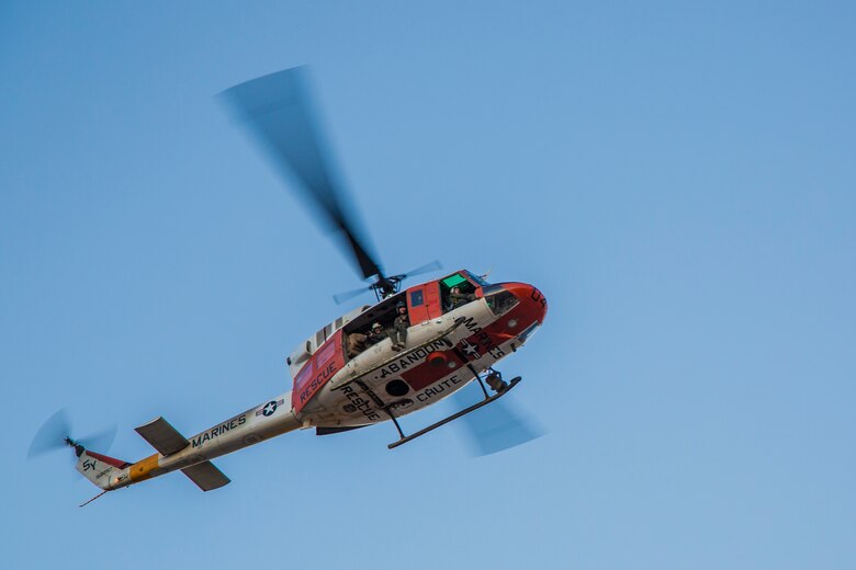 U.S. Marines with Search and Rescue (SAR), Headquarters and Headquarters Squadron, Marine Corps Air Station Yuma, fly over the first annual Telegraph Pass Challenge in Yuma, Ariz., Nov. 3, 2018. The challenge, coordinated by Marine Corps Community Services (MCCS), offered participants the opportunity to compete for first, second, or third place in either a 5 mile run, 5 mile bike route, or both. The course included a "Blue Mile" which is typically the most difficult portion of the racing event being a silent mile. The "Blue Mile" honors and remembers all fallen heroes of the Military, Police, and Fire Department. (U.S. Marine Corps photo by Sgt. Allison Lotz)