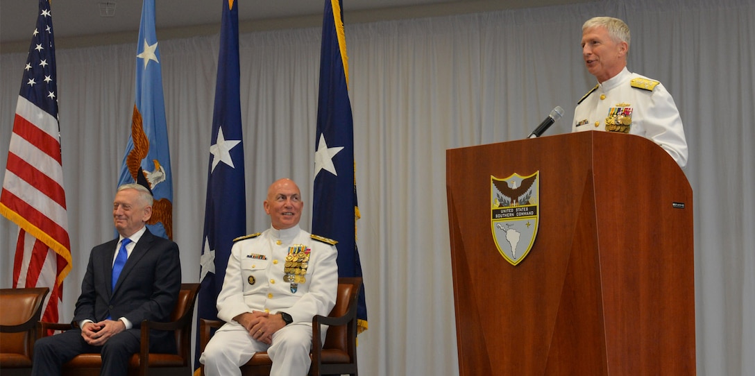 Miami - Adm. Craig S. Faller, USN, right, incoming commander of U.S. Southern Command, addresses the audience during the change of command ceremony change of command ceremony.