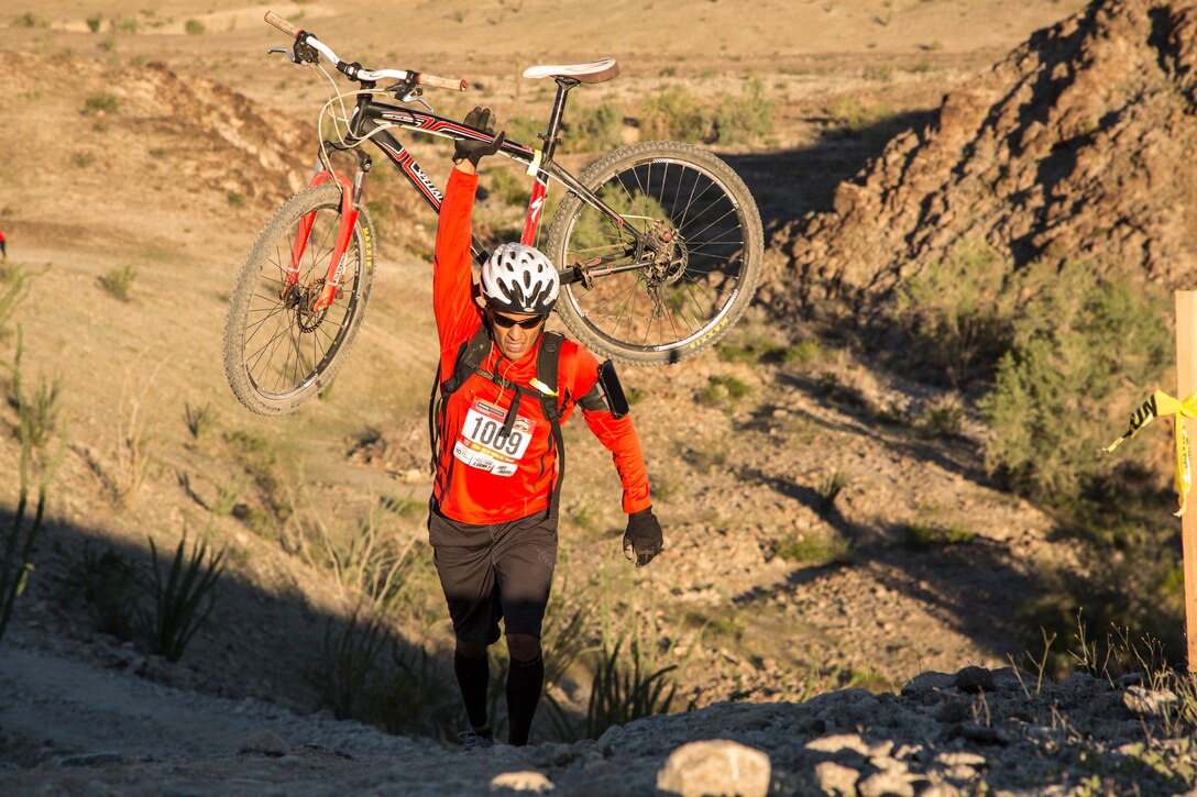 U.S. Marines, Sailors, and civilians participate in the first annual Telegraph Pass Challenge in Yuma, Ariz., Nov. 3, 2018. The challenge, coordinated by Marine Corps Community Services (MCCS), offered participants the opportunity to compete for first, second, or third place in either a 5 mile run, 5 mile bike route, or both. The course included a "Blue Mile" which is typically the most difficult portion of the racing event being a silent mile. The "Blue Mile" honors and remembers all fallen heroes of the Military, Police, and Fire Department. (U.S. Marine Corps photo by Sgt. Allison Lotz)
