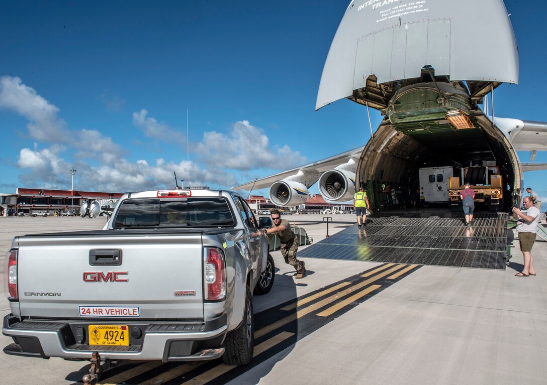 U.S. Air Force Staff Sgt. Keaton Truman, 36th Mobility Response Squadron crew chief, at Andersen Air Force Base, Guam, offloads a truck from an Antonov An-225 Mriya in Saipan, Commonwealth of the Northern Mariana Islands (CNMI) Nov. 3, 2018.