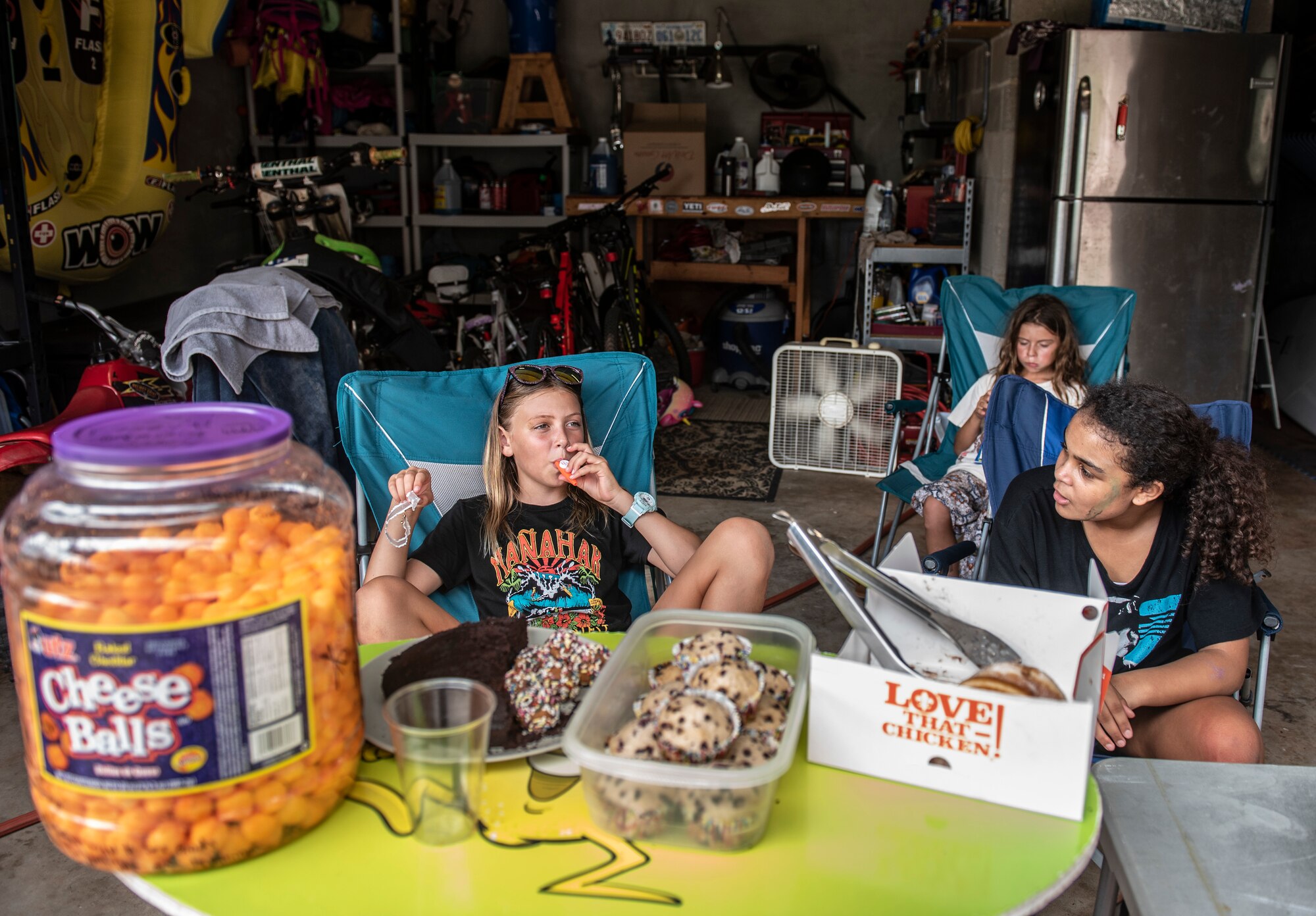 Hayden 8-years-old, London 10-years-old and Olivia 9-years-old wait on customers at their lemonade stand in Yona, Guam Nov. 15, 2018.