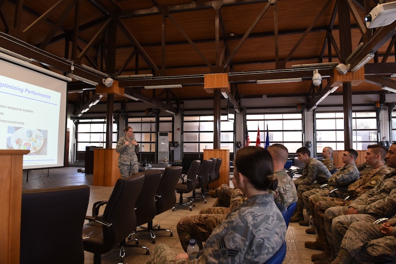 U.S. Air Force Capt. Abigail Schutz briefs members of the 728th Air Mobility Squadron at Incirlik Air Base.