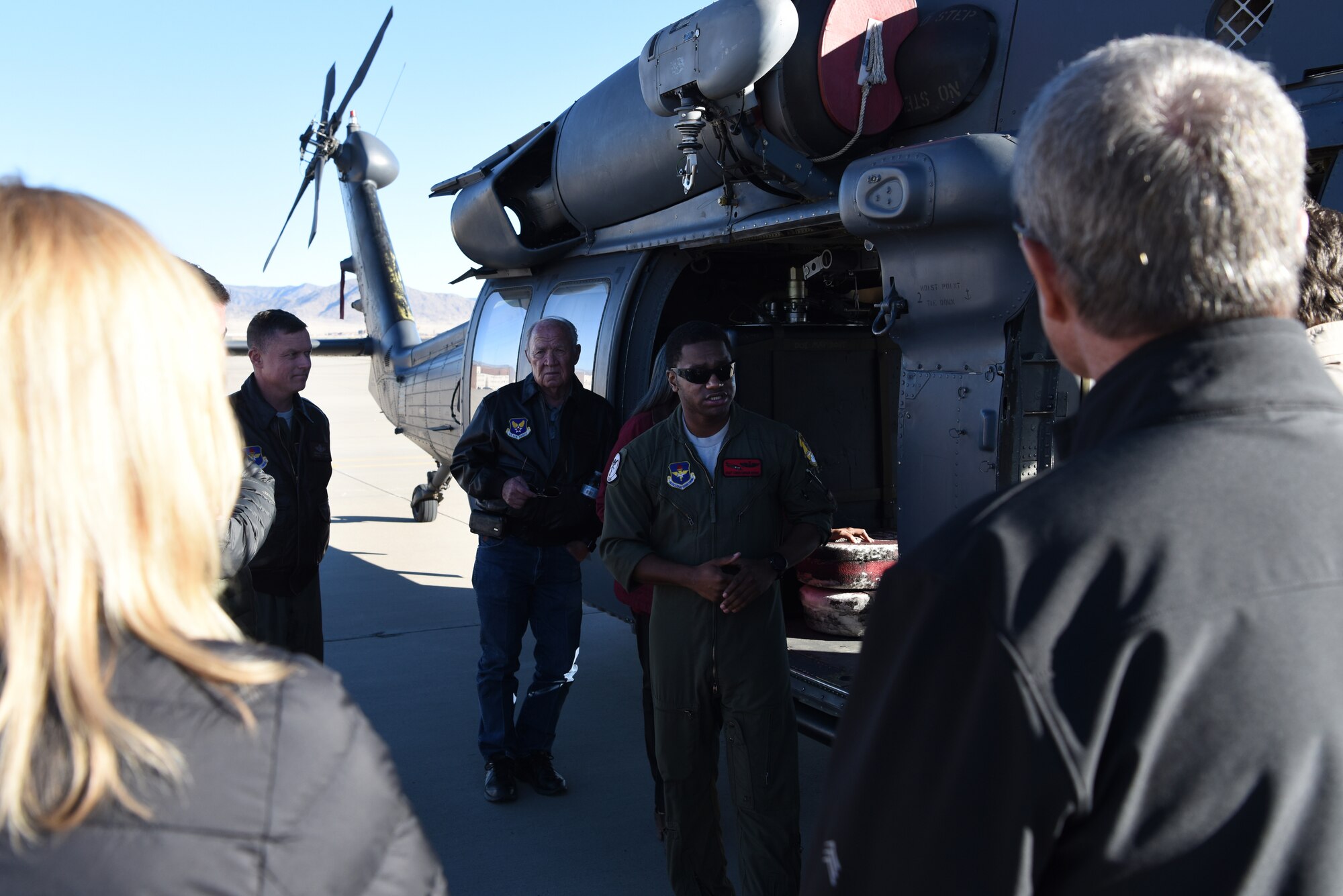 U.S. Air Force Staff Sgt. Christopher Myers, 512th Rescue Squadron special mission aviator, discusses the capabilities of the HH-60G Pave Hawk with members of the Kirtland Partnership Committee at Kirtland Air Force Base, N.M., Nov. 26, 2018.  The KPC is a local civic group that advocates for Team Kirtland and its part of the National Security Complex. (U.S. Air Force photo by Senior Airman Eli Chevalier)