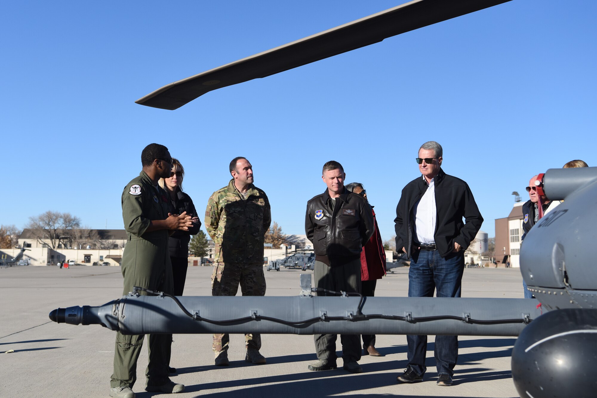 Airmen of the 58th Special Operations Wing provide a mission brief of the HH-60G Pave Hawk to members of the Kirtland Partnership Committee at Kirtland Air Force Base, N.M., Nov. 26, 2018. The 58th SOW trains pilots and special mission aviators in a variety of aircraft. (U.S. Air Force photo by Senior Airman Eli Chevalier)