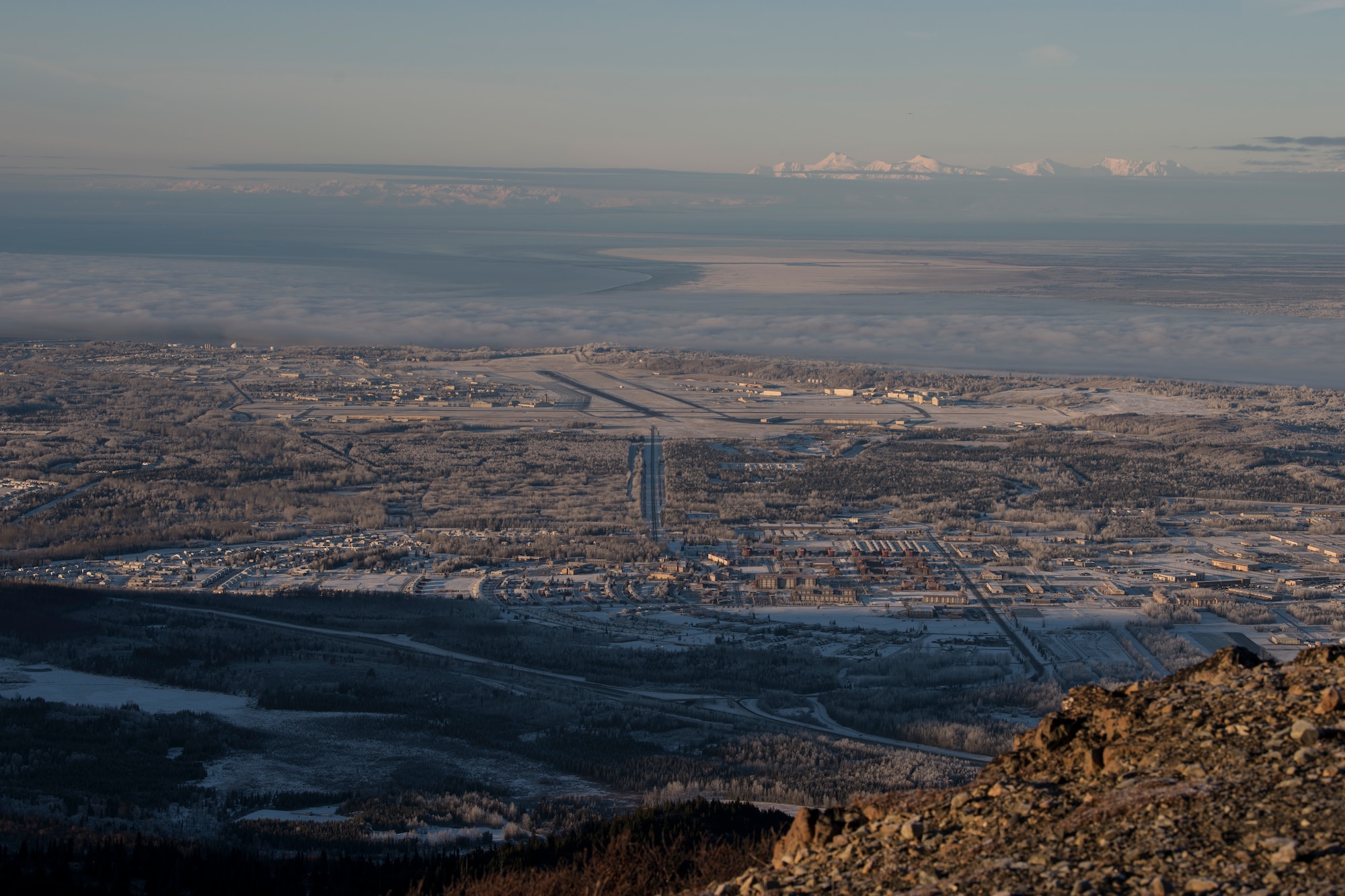 A view of Joint Base Elmendorf-Richardson and surrounding area can be seen from the star placed on the side of Mount Gordon Lyon at JBER, Alaska, Nov. 23, 2018. Throughout the past 60 years, the history, location and size of the brightly lit star has changed. However, the unwavering dedication Airmen and Soldiers have shown to it has not.