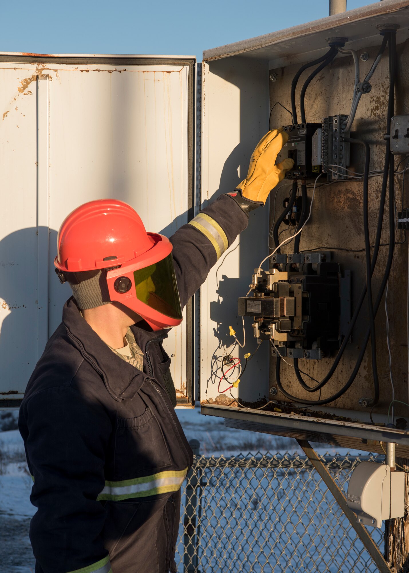 U.S. Air Force Staff Sgt. Steven Andersen, 773d Civil Engineer Squadron electrical shop exterior electric noncommissioned officer in charge, flips on a breaker conducting electricity to the brightly lit star on the side of Mount Gordon Lyon at Joint Base Elmendorf-Richardson, Alaska, Nov. 23, 2018. Despite the unforeseeable weather conditions and possible challenges Airmen may face carrying out the JBER tradition, the lighting of the star during the holiday season always happens the Friday after Thanksgiving.