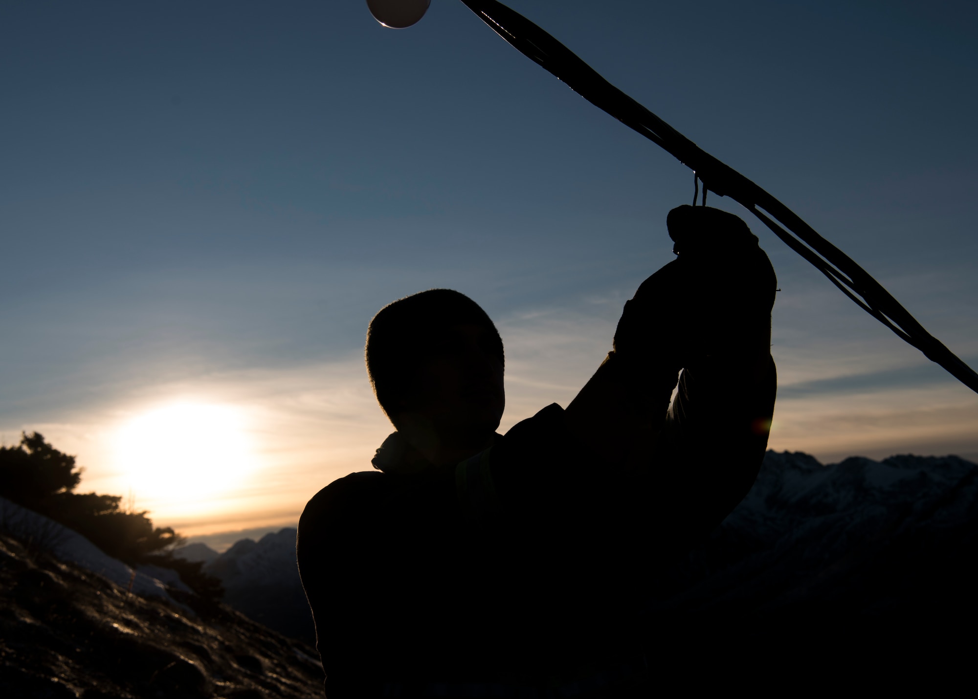 U.S. Air Force Staff Sgt. Steven Andersen, 773d Civil Engineer Squadron electrical shop exterior electric noncommissioned officer in charge, inspects wiring on the brightly lit star placed on the side of Mount Gordon Lyon at Joint Base Elmendorf-Richardson, Alaska, Nov. 23, 2018. The star spans more than 300 feet and is located in an area just below the old U.S. Army Air Defense Command Nike Hercules missile battery – one of three which defended the Anchorage bowl during the Cold War. Since 2010, Airmen from the 773d CES electrical shop have assumed caretaking responsibility for the stars location.