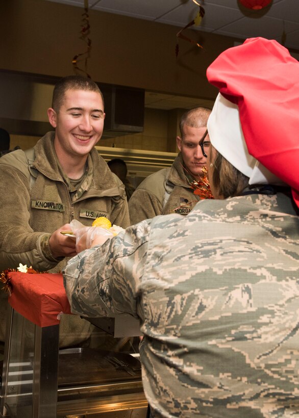 U.S. Air Force Col. Erin Cluff, 633rd Mission Support Group commander, serves a U.S. Army Soldier a Thanksgiving meal at Joint Base Langley-Eustis, Virginia, Nov. 22, 2018.