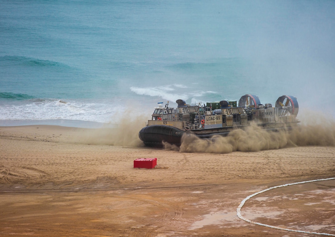 A U.S. Navy Landing Craft, Air Cushioned hovercraft carrying Marines and equipment from Special Purpose Marine Air-Ground Task Force - Peru arrives at the coastline during a humanitarian assistance and disaster relief demonstration between U.S. Marines and Peruvian naval forces Nov. 24, 2018, near Lima, Peru.