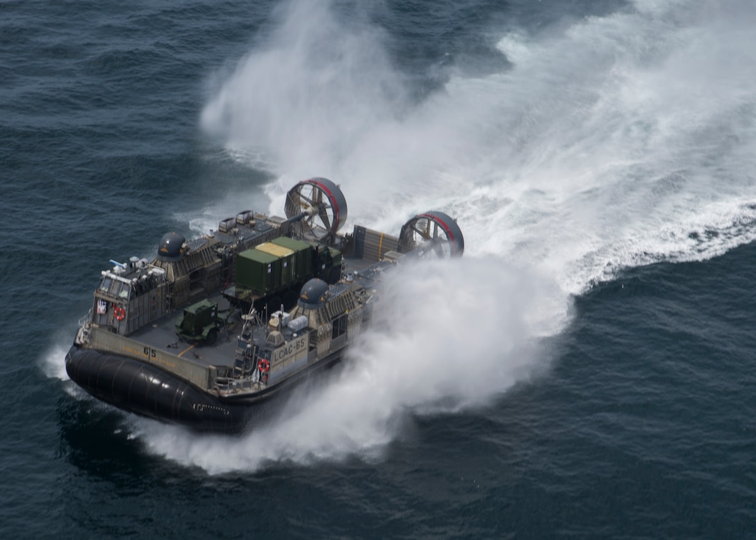 A U.S. Navy Landing Craft, Air Cushion hovercraft transports Marines and equipment with Special Purpose Marine Air-Ground Task Force - Peru during a humanitarian assistance and disaster relief exercise off of the coast of Chorrillos Beach near Lima, Peru, Nov. 24, 2018.