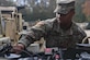 U.S. Army Spc. Takory Coleman, 149th Seaport Operations Company, 10th Transportation Battalion, 7th Trans. Brigade (Expeditionary) transportation management coordinator, checks the oil of a HUMVEE at Joint Base Langley-Eustis, Virginia, Nov. 19, 2018. The vehicle mechanics of the 149th SOC conduct preventative maintenance checks every week to limit and identify any issues the vehicles may have. (U.S. Air Force photo by Senior Airman Derek Seifert)