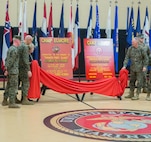 U.S. Marines assigned to U.S. Marine Corps Forces Command and distinguished guests join Deborah Hager during a ceremony where Camp Allen was rededicated as Camp Elmore in honor of Pfc. George W. Elmore, Nov. 27, 2018, at Camp Elmore, Norfolk, Virginia. Hager accepted the honor on behalf of her uncle, Elmore, who gallantly gave his life during combat operations in Hoeng Son, Korea, Feb 26, 1951. (Official U.S. Marine Corps photo by Chris Jones/Released)