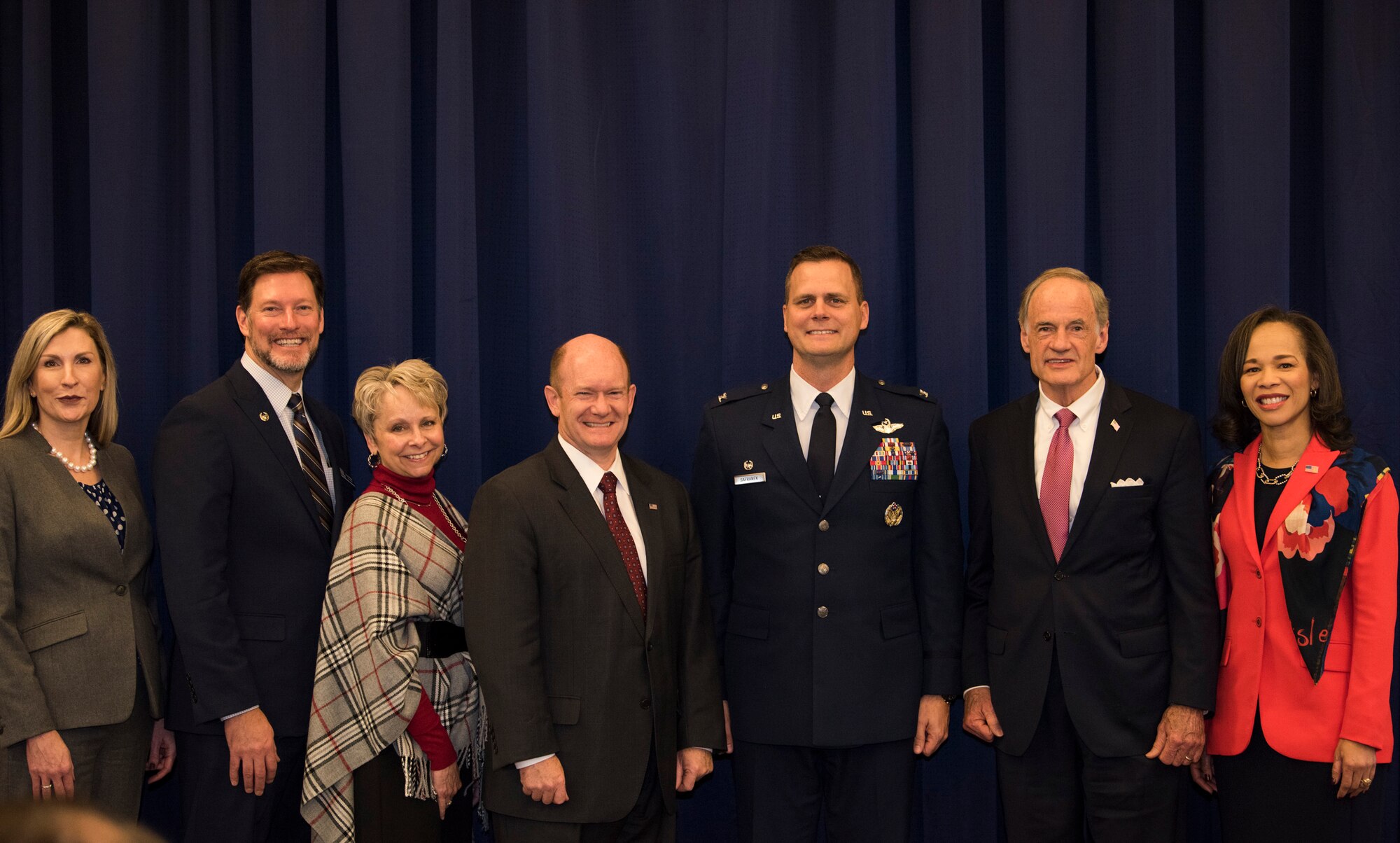 Lynne Schaefer, Military Affairs Committee Chair, Sean Mace, Chairman of the Board of Directors for the Central Delaware Chamber of Commerce, Judy Diogo-Schrock, President, CDCC, U.S. Senator Chris Coons, Col. Joel Safranek, 436th Airlift Wing commander, U.S. Senator Tom Carper, and U.S. Rep. Lisa Blunt-Rochester, pose for a group photo following the formal portion of the 2018 State of the Base breakfast Nov. 19, 2018, at Dover Air Force Base, Del. The event was hosted by the CDCC and is aimed to provide information on Dover AFB’s current and future projects. (U.S. Air Force photo by Airman 1st Class Zoe M. Wockenfuss)