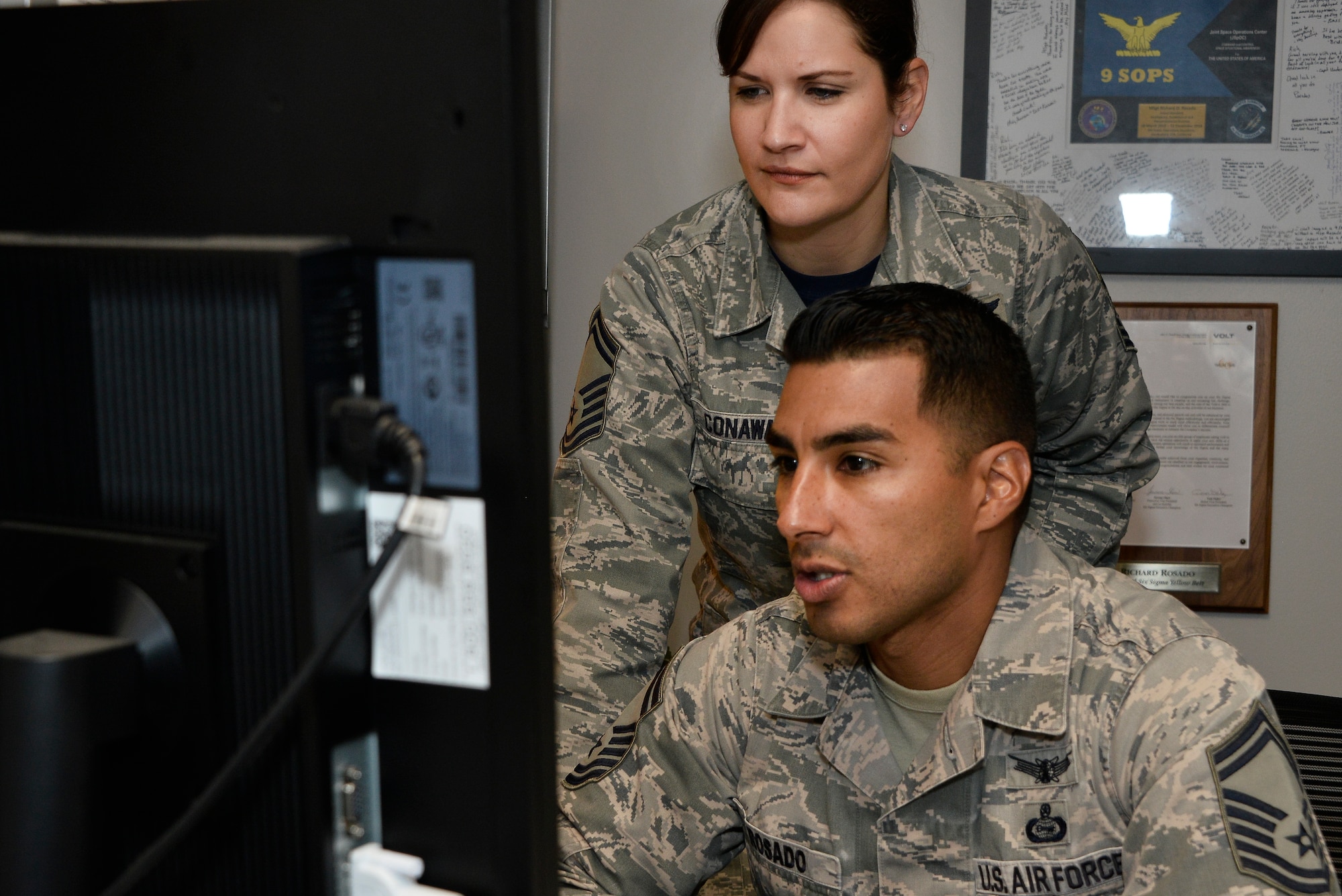 Senior Master Sgt. Kori Conway, and SMSgt Richard Rosado 16th Intelligence Squadron operation superintendent, look over production reports November 9, 2018 at Fort George G. Meade, Maryland. In a recent overlook, Reserve Airmen complete close to 20 percent of the Air Force mission to include flying and special missions. (U.S. Air Force photo by Staff Sgt. Alexandre Montes)