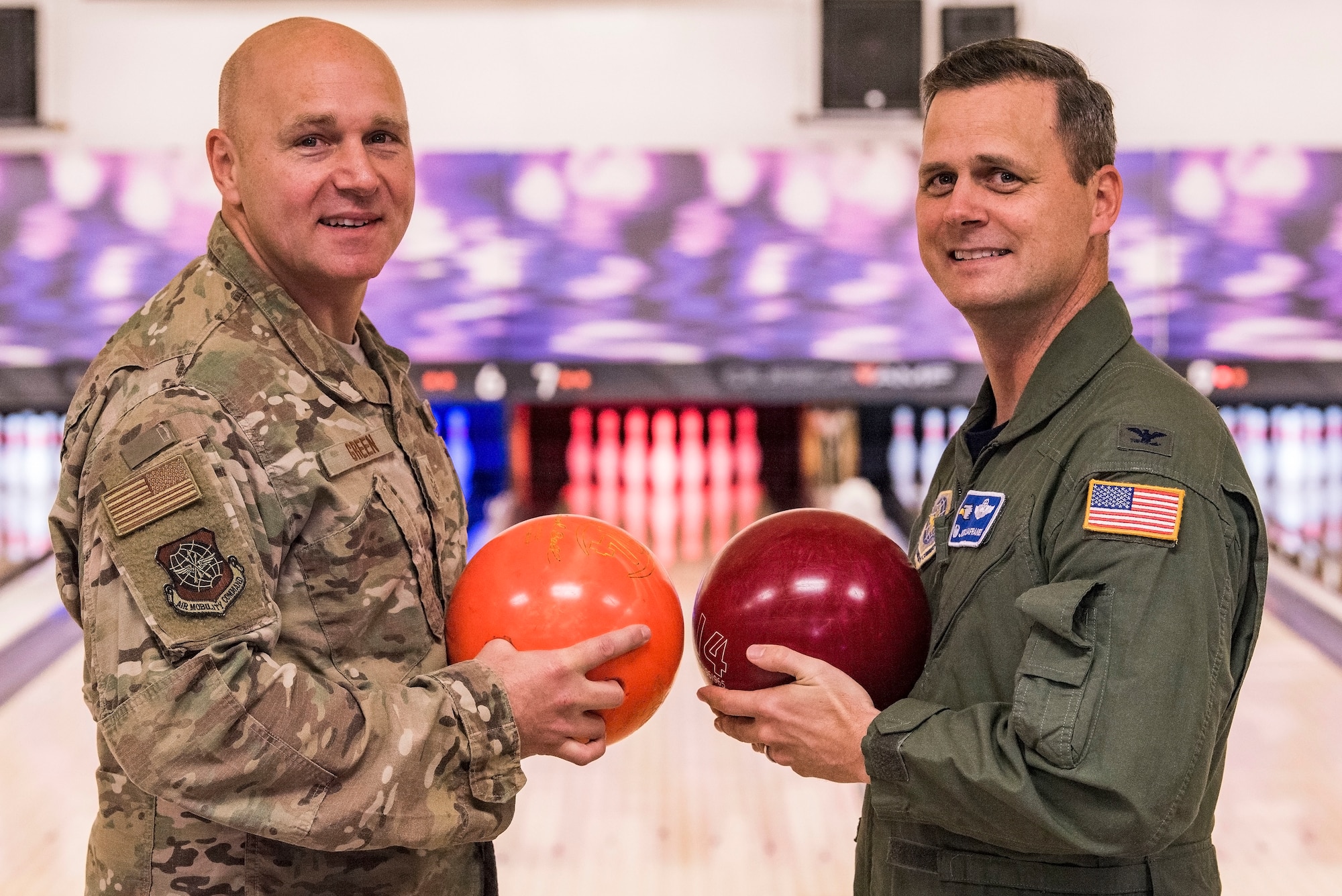 Col. Joel Safranek, right, 436th Airlift Wing commander, and Chief Master Sgt. Anthony Green, left, 436th AW command chief, pose for a photo prior to the start of their bowling grudge match Nov. 16, 2018, at the Eagle Lanes on Dover Air Force Base, Del. Safranek challenged Green to a two-out-of-three game grudge match after losing to Green during the 436th AW Leadership Off-Site back in September. Bowling was the close-out event for Dover AFB’s 2018 Combined Federal Campaign. (U.S. Air Force photo by Roland Balik)