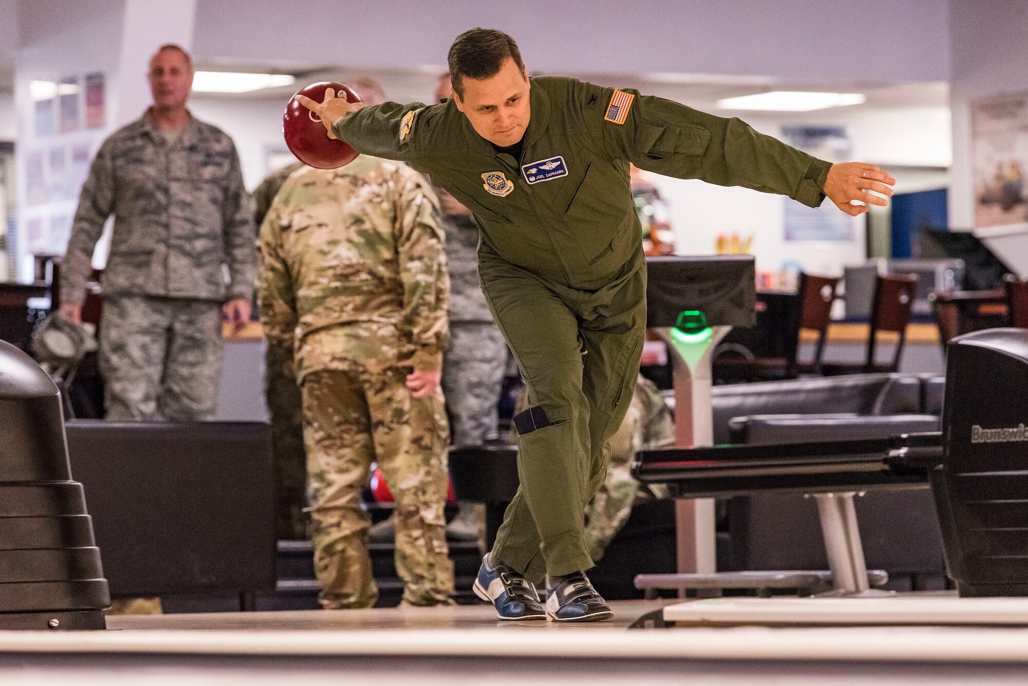 Col. Joel Safranek, 436th Airlift Wing commander, winds up as he approaches his lane for a shot during a bowling grudge match Nov. 16, 2018, at the Eagle Lanes on Dover Air Force Base, Del. Safranek challenged Chief Master Sgt. Anthony Green, 436th AW command chief, to the grudge match at the close-out event for Dover AFB’s 2018 Combined Federal Campaign. Safranek won the second of three games sending the match to a third game tie-breaker that was won by Green. (U.S. Air Force photo by Roland Balik)