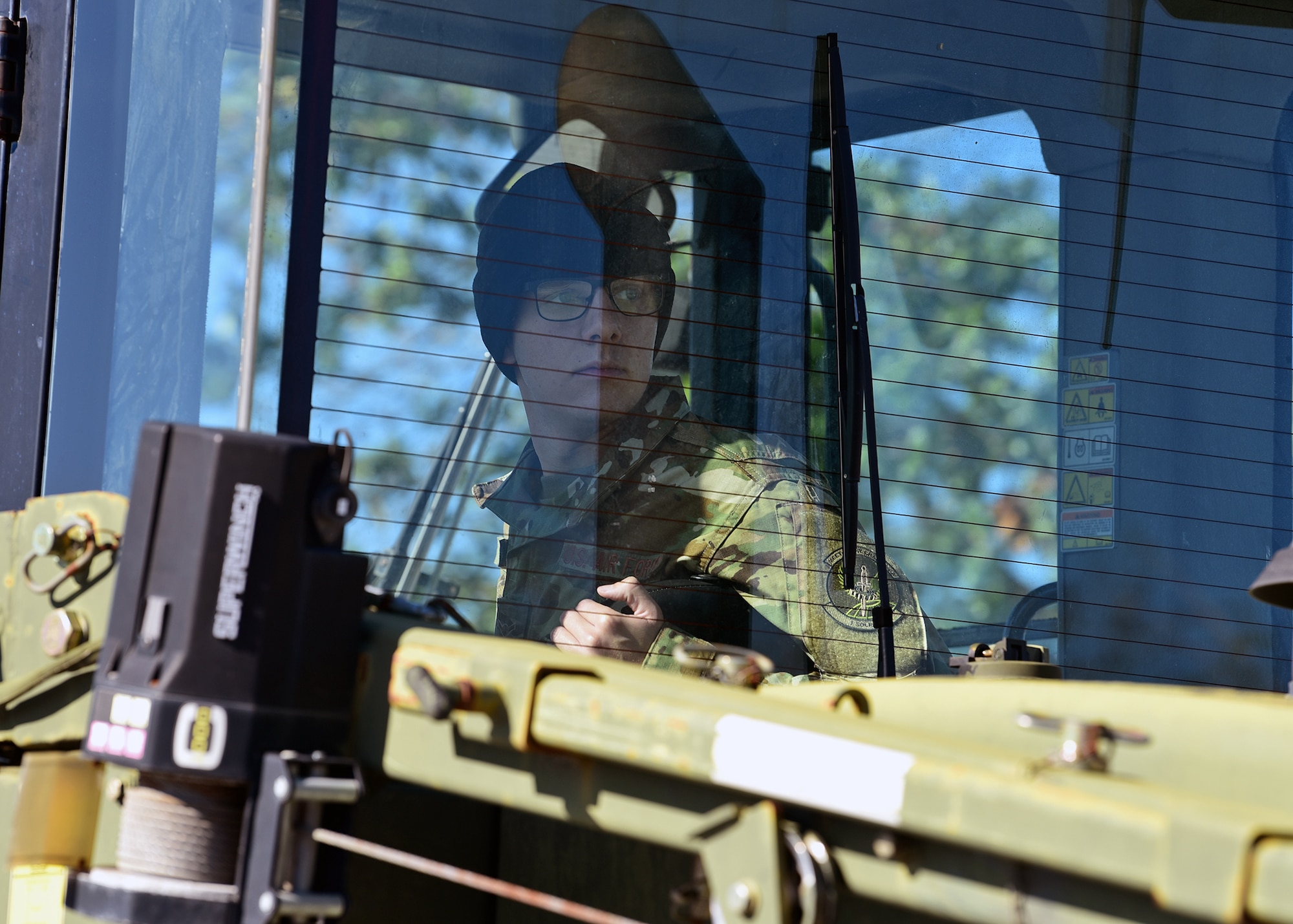 Airman Christian Myers, 1st Special Operations Logistics Readiness Squadron vehicle operator, operates heavy equipment while at Tyndall Air Force Base, Fla., Nov. 27, 2018. Myers is temporarily stationed at Tyndall to aid in the large-scale cleanup and reconstruction efforts that are underway. (U.S. Air Force photo by Senior Airman Isaiah J. Soliz)