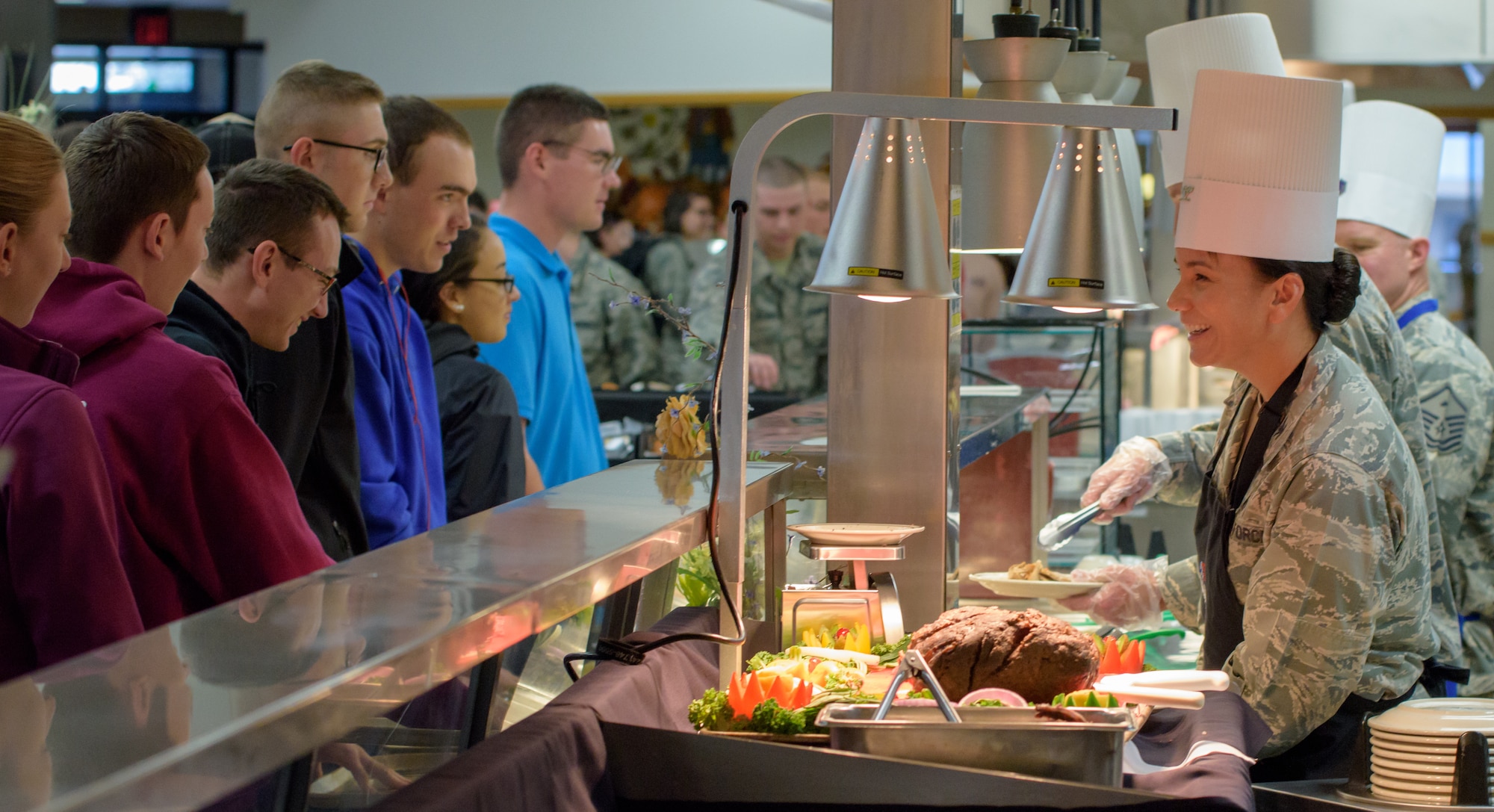 U.S. Air Force Col. Debra Lovette, 81st Training Wing commander, serves Thanksgiving Day lunch to service members inside the Azalea Dining Facility at Keesler Air Force Base, Mississippi, Nov. 22, 2018. It is tradition at Keesler for commanders, first sergeants and superintendents to take time out of their holiday to serve a Thanksgiving meal to technical training and permanent party Airmen. (U.S. Air Force photo by Andre' Askew)