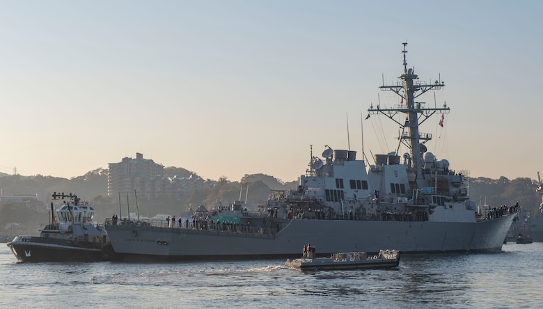 YOKOSUKA, Japan (Nov. 27, 2018) The Arleigh Burke-class guided missile destroyer USS John S. McCain (DDG 56) is pulled towards a pier after departing from a dry dock at Fleet Activities Yokosuka. McCain is departing the dock after an extensive maintenance period in order to sustain the ship's ability to serve as a forward-deployed asset in the U.S. 7th Fleet area of operations. (U.S. Navy Photo by Mass Communication Specialist 2nd Class Jeremy Graham)