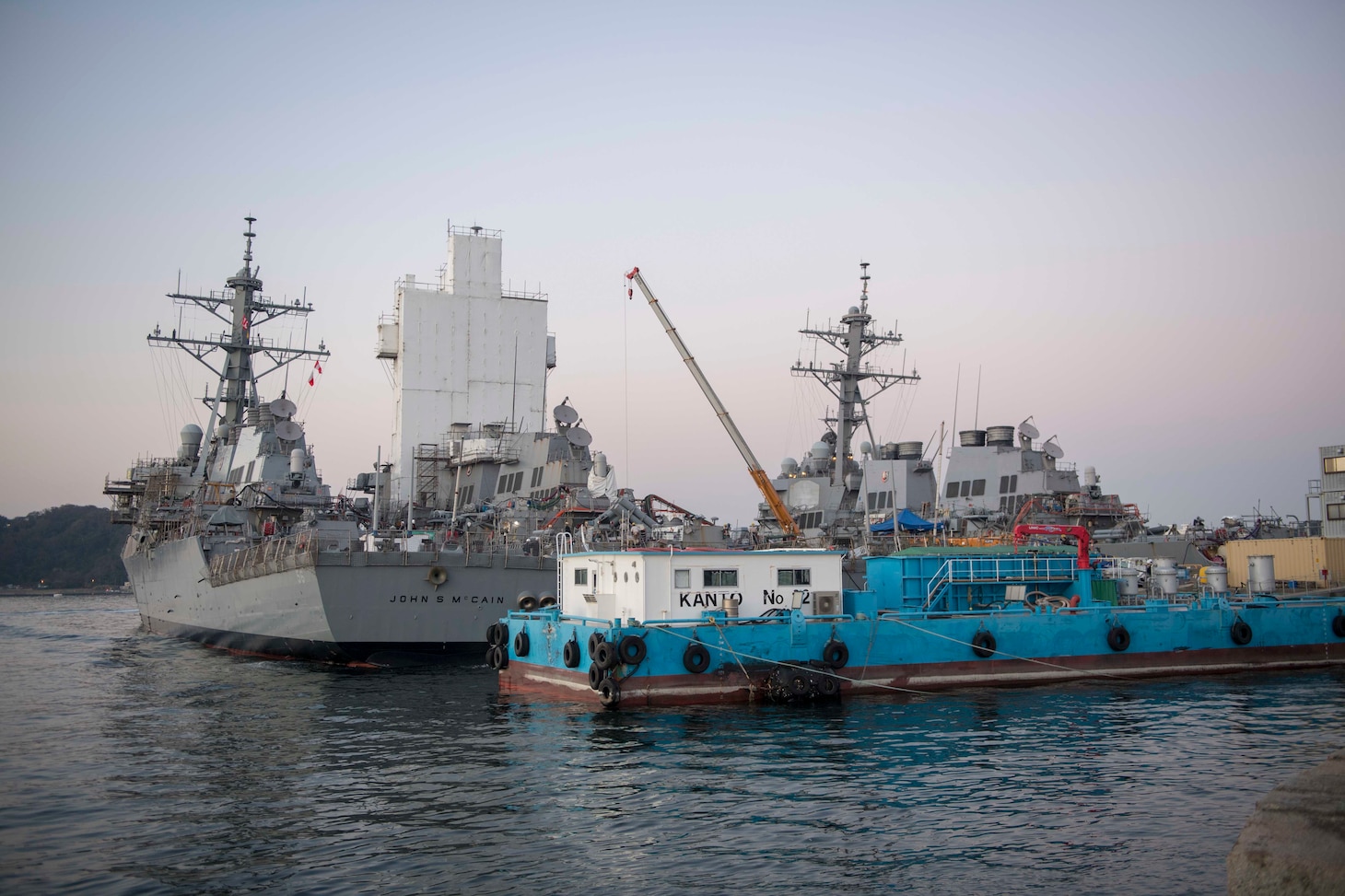 YOKOSUKA, Japan (Nov. 27, 2018) The Arleigh Burke-class guided missile destroyer USS John S. McCain (DDG 56) sits pierside after departing from a dry dock at Fleet Activities Yokosuka. McCain departed the dock after an extensive maintenance period in order to sustain the ship's ablity to serve as a forward-deployed asset in the U.S. 7th Fleet area of operations.