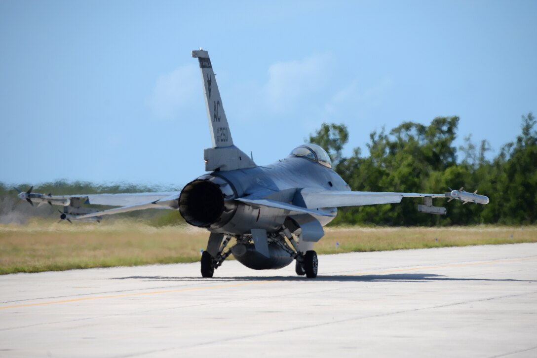 A picture of a U.S. Air Force F-16C Fighting Falcon taxis towards the active runway at Boca Chica Naval Air Station, Florida.