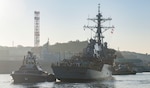 YOKOSUKA, Japan (Nov. 27, 2018) The Arleigh Burke-class guided missile destroyer USS John S. McCain (DDG 56) is pulled towards a pier after departing from a dry dock at Fleet Activities Yokosuka. McCain is departing the dock after an extensive maintenance period in order to sustain the ship's ability to serve as a forward-deployed asset in the U.S. 7th Fleet area of operations.