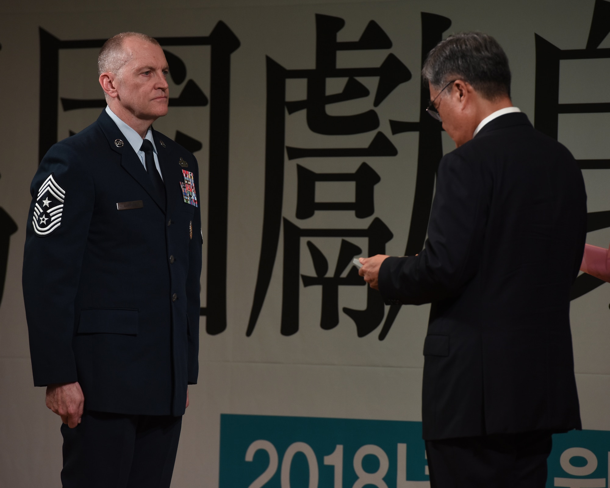 U.S. Air Force Chief Master Sgt. Scott Lumpkin, Seventh Air Force command chief, receives the Republic of Korea – U.S. Alliance Award from Jeong Kyeongdoo, minister of the ROK Ministry of National Defense, in Seoul, ROK, Nov. 14, 2018. Lumpkin is the first enlisted U.S. Air Force member to receive the award for military service and his dedication to strengthening the ROK and U.S. alliance. (U.S. Air Force photo by Staff Sgt. Sergio A. Gamboa)