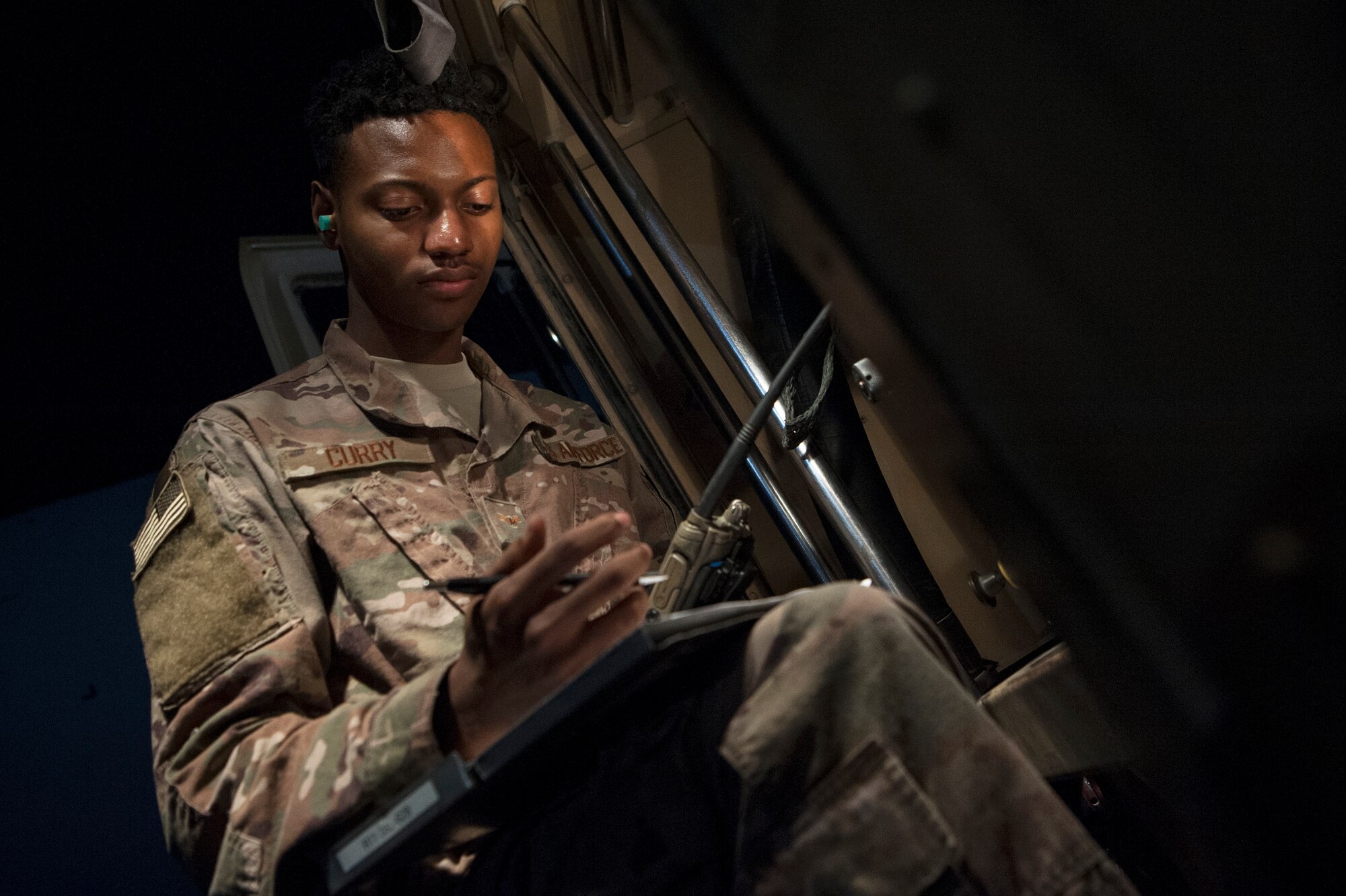 Airman 1st Class Christen Curry, 379th Expeditionary Logistics Readiness Squadron fuels distribution operator, logs information during the refueling of a KC-135 Stratotanker Nov. 28, 2018, at Al Udeid Air Base, Qatar.