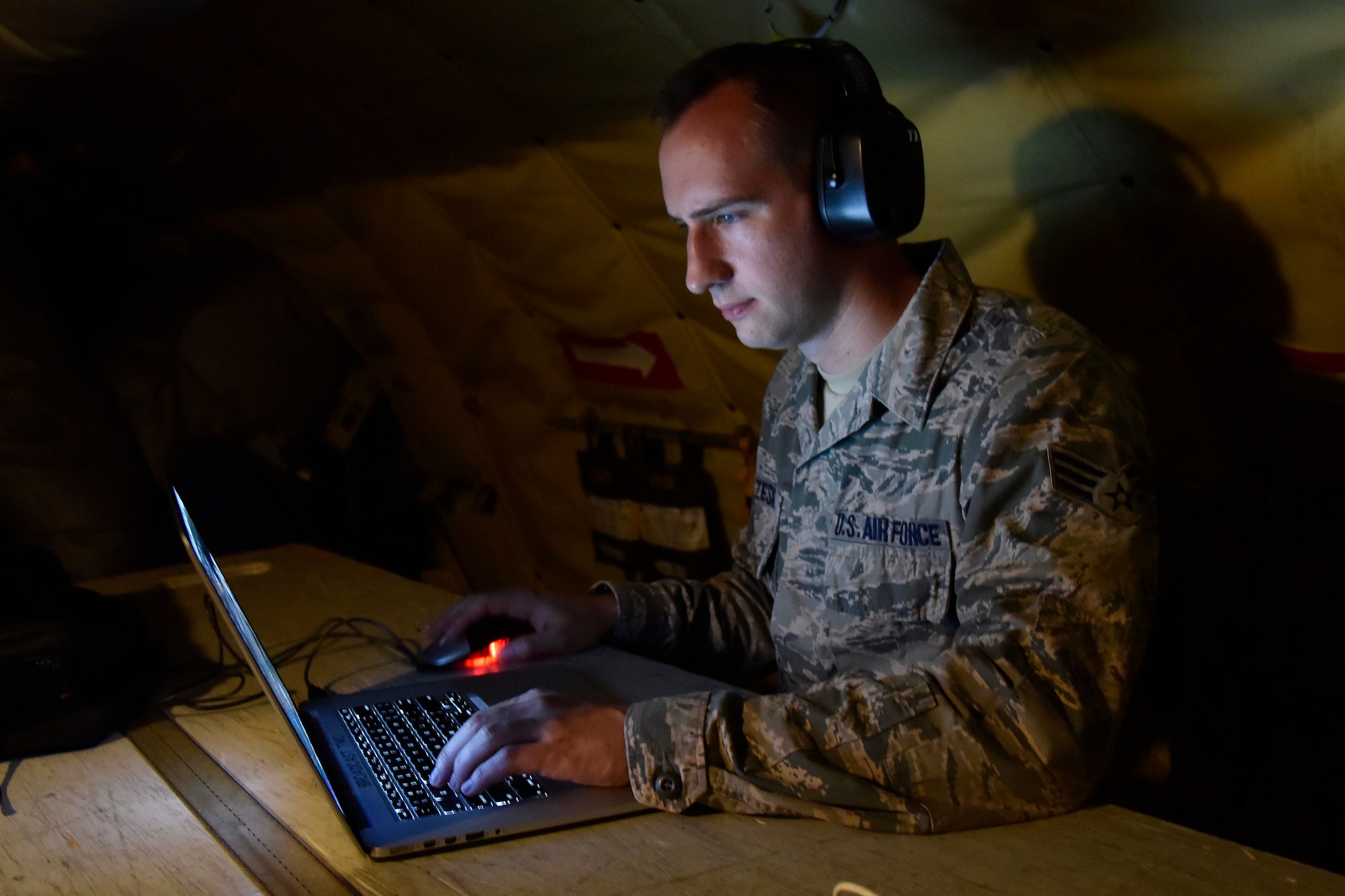 Senior Airman Ryan Zeski utilizes time during a long flight as a passenger on a Michigan Air National Guard KC-135 Stratotanker to work on some homework for a course he is taking at Oakland University in MIchigan, Nov. 8, 2018.