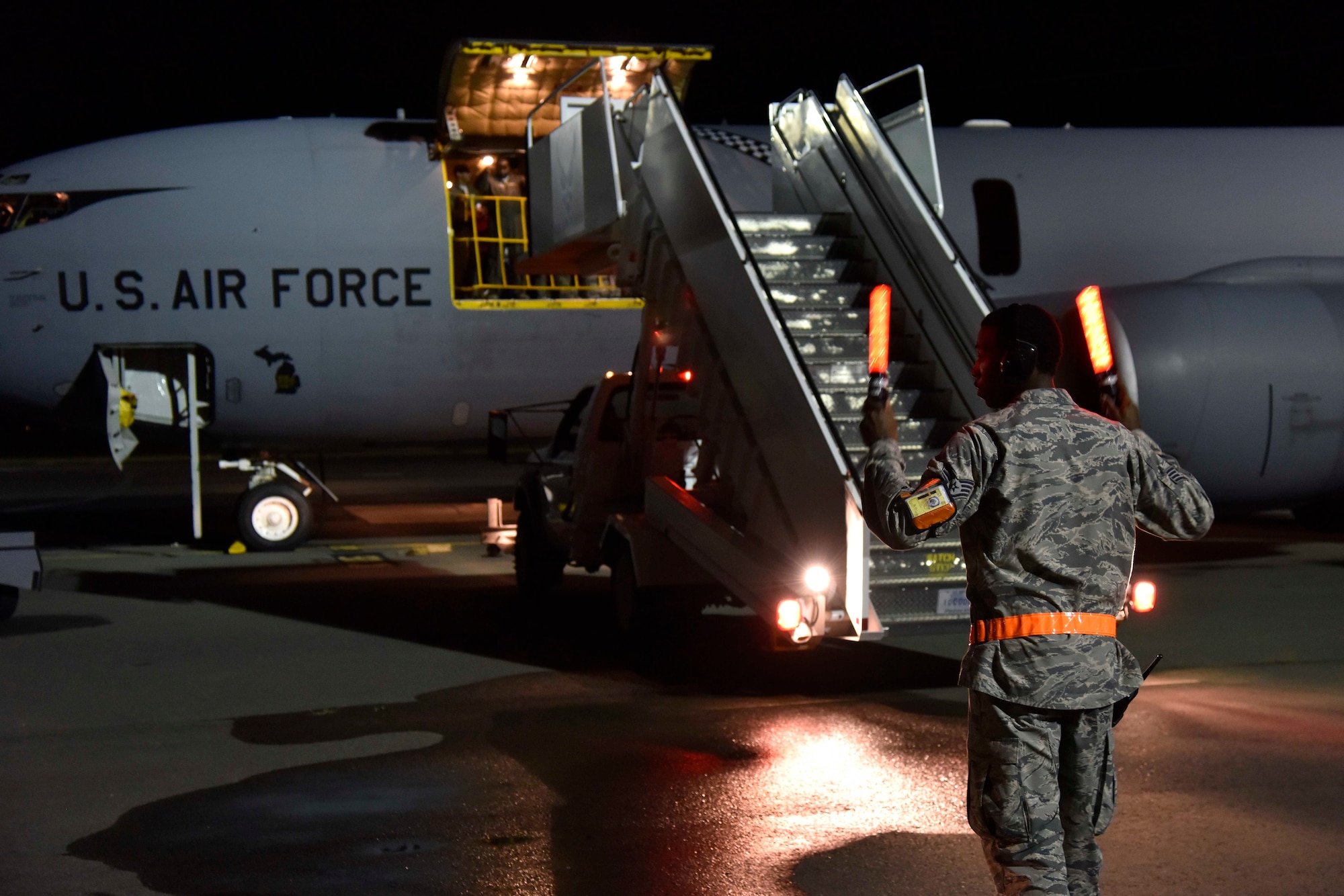 Air stairs are backed away from a KC-135 Stratotanker prior to an early evening take-off at Joint Base Pearl Harbor Hickam, Hawaii, Nov, 9, 2018.