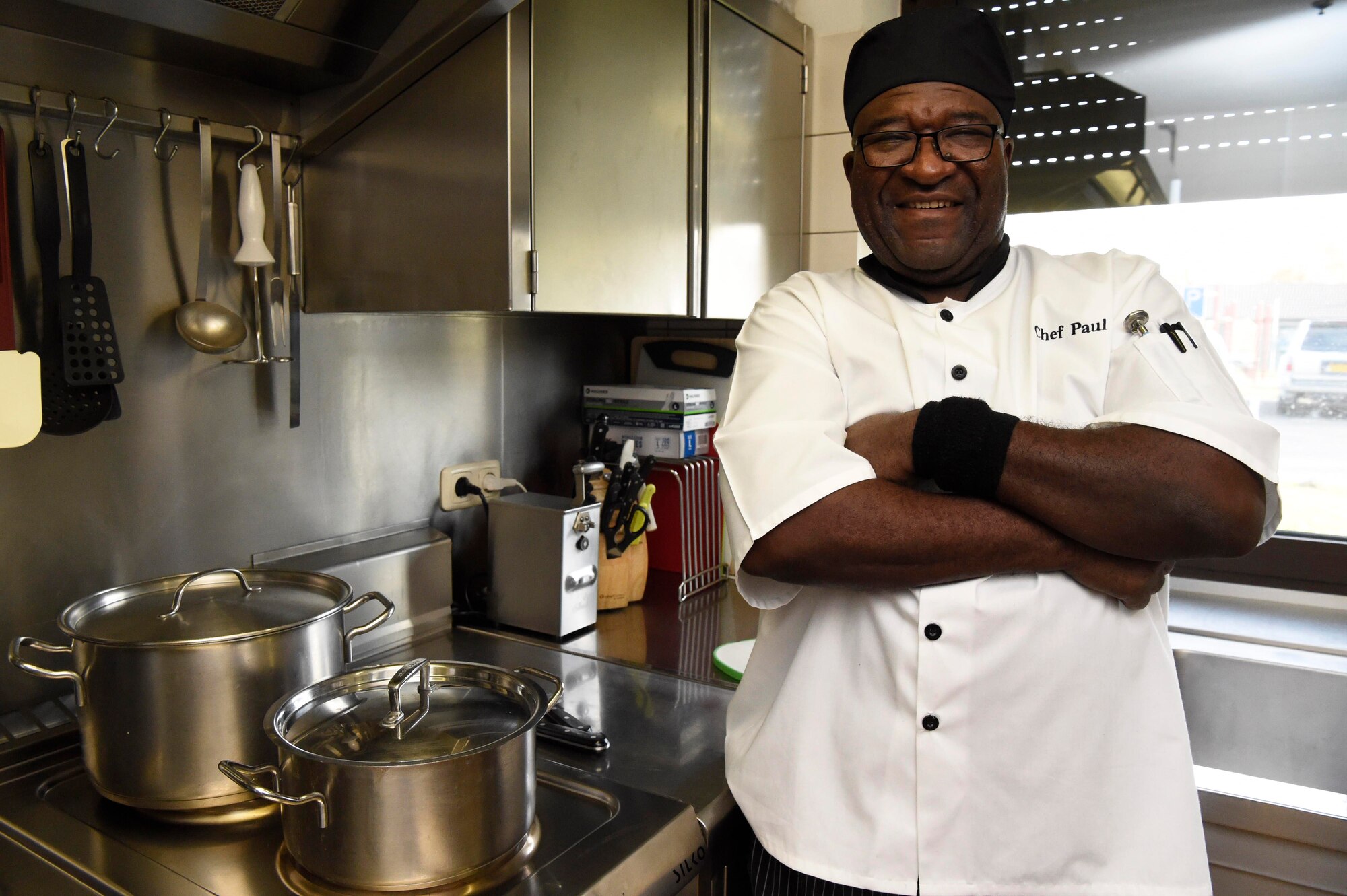 A chef poses for a photo