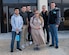 Andrea Stalnik (center) poses with U.S. Army Soldiers from the 128th Aviation Brigade in Hampton, Virginia, Nov. 22, 2018.