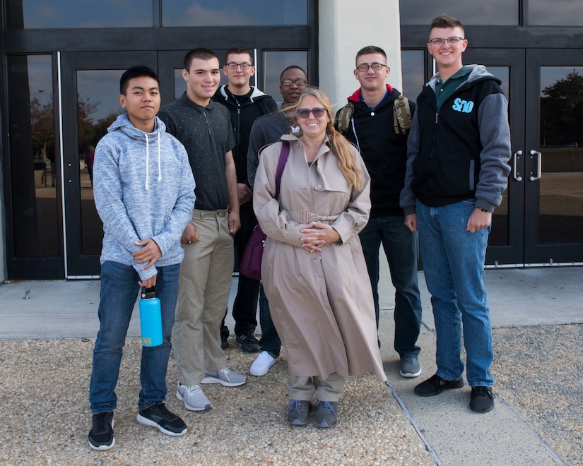 Andrea Stalnik (center) poses with U.S. Army Soldiers from the 128th Aviation Brigade in Hampton, Virginia, Nov. 22, 2018.