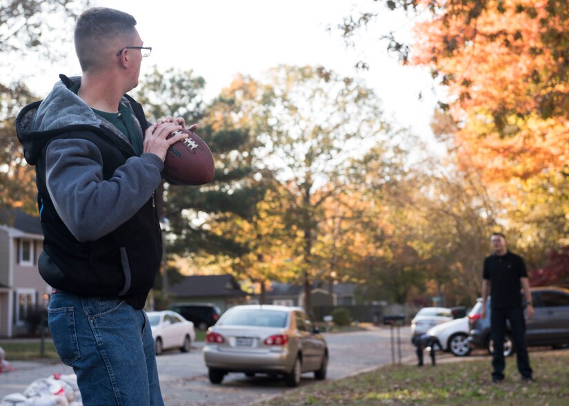 U.S. Army Pfc. William Wedgeworth, 128th Aviation Brigade Advanced Individual Training student, throws a football in Newport News, Virginia, Nov. 22, 2018.