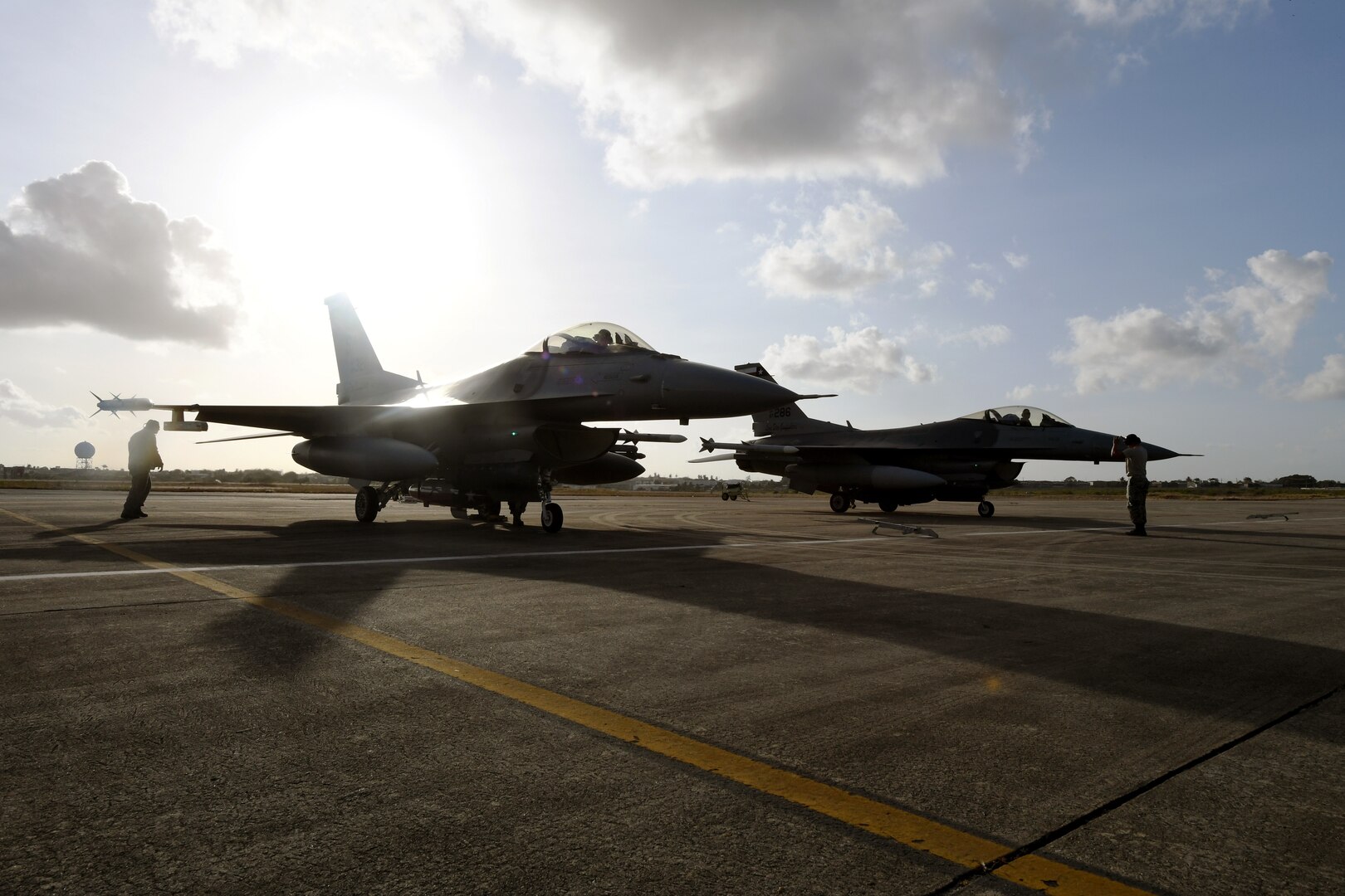 Two F-16 Fighting Falcons from the 149th Fighter Wing, Air National Guard, line the apron at Natal Air Force Base in Natal, Brazil, Nov. 16, 2018.