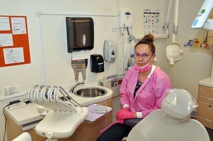 U.S. Army Spc. Tatiana Lafferty, a carpentry masonry specialist with the 155th Engineer Company, South Dakota Army National Guard, sits with her dental equipment at Indian Health Services, Nov. 1, 2018, in Rapid City, S.D. Lafferty works full-time as a dental technician with IHS, while also attending to her duties as a single mother, full-time student and an Army National Guard Soldier.