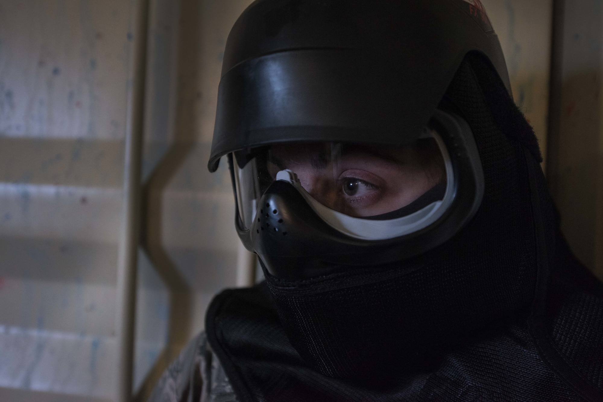 Airman Emily Bratton, 375th Security Forces Squadron entry controller, prepares herself with protective gear during taser training at Scott Air Force Base, Illinois on Nov. 19, 2018. Bratton faced a simulated threat against which she had to determine the appropriate amount of force to use. (U.S. Air Force photo by Senior Airman Daniel Garcia)