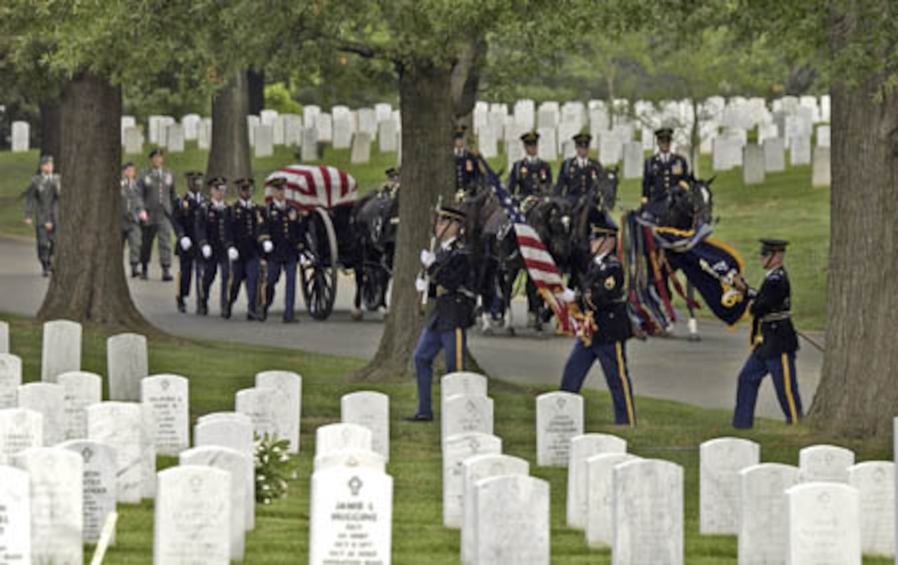 Soldiers escort casket to grave