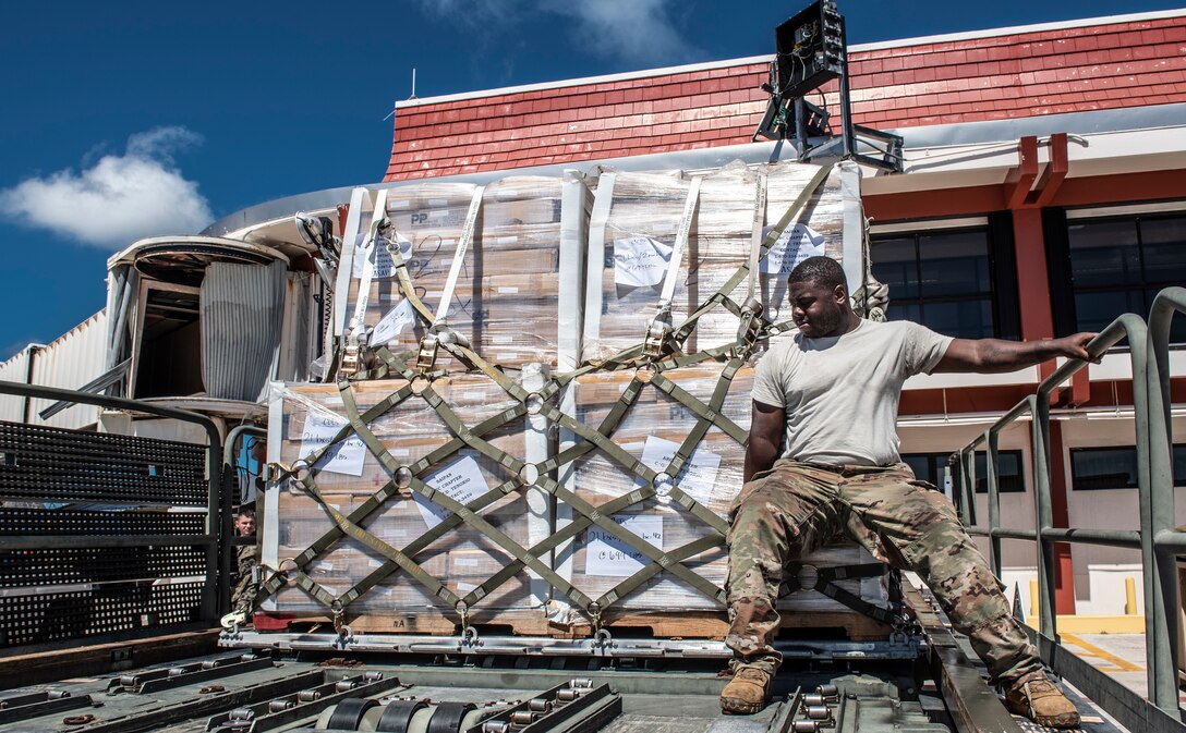 U.S. Air Force Staff Sgt. Deangelo Sidney, 36th Mobility Response Squadron aerial porter, secures a pallet on a Halverson loader in Saipan, Commonwealth of the Northern Mariana Islands (CNMI) Nov. 5, 2018. In response to Super Typhoon Yutu, members from 36th Contingency Response Group and Indo-Pacific Command are supporting recovery efforts alongside CNMI’s civil and local officials, and the Federal Emergency Management Agency. (U.S. Air Force photo by Master Sgt. JT May III)